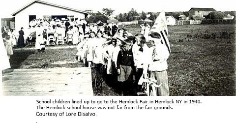 hcl_fair_hemlock_1940_children_with_flag_resize480x195